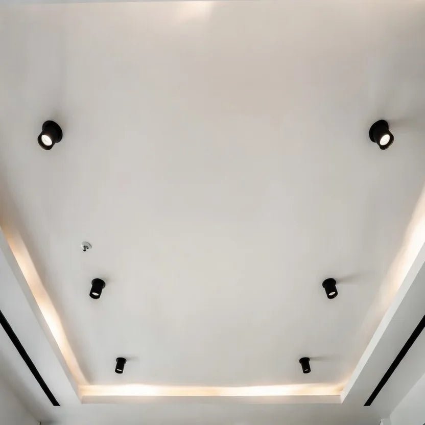 Modern ceiling design with recessed lights on a white ceiling