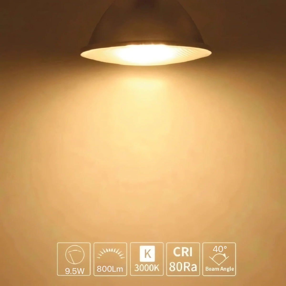 Light fixture emitting a warm glow on a beige wall with technical specifications displayed.