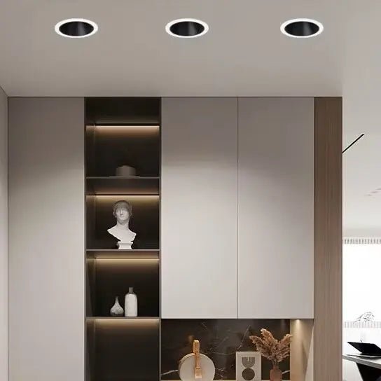 Modern interior design with ceiling lights and wall-mounted shelves.