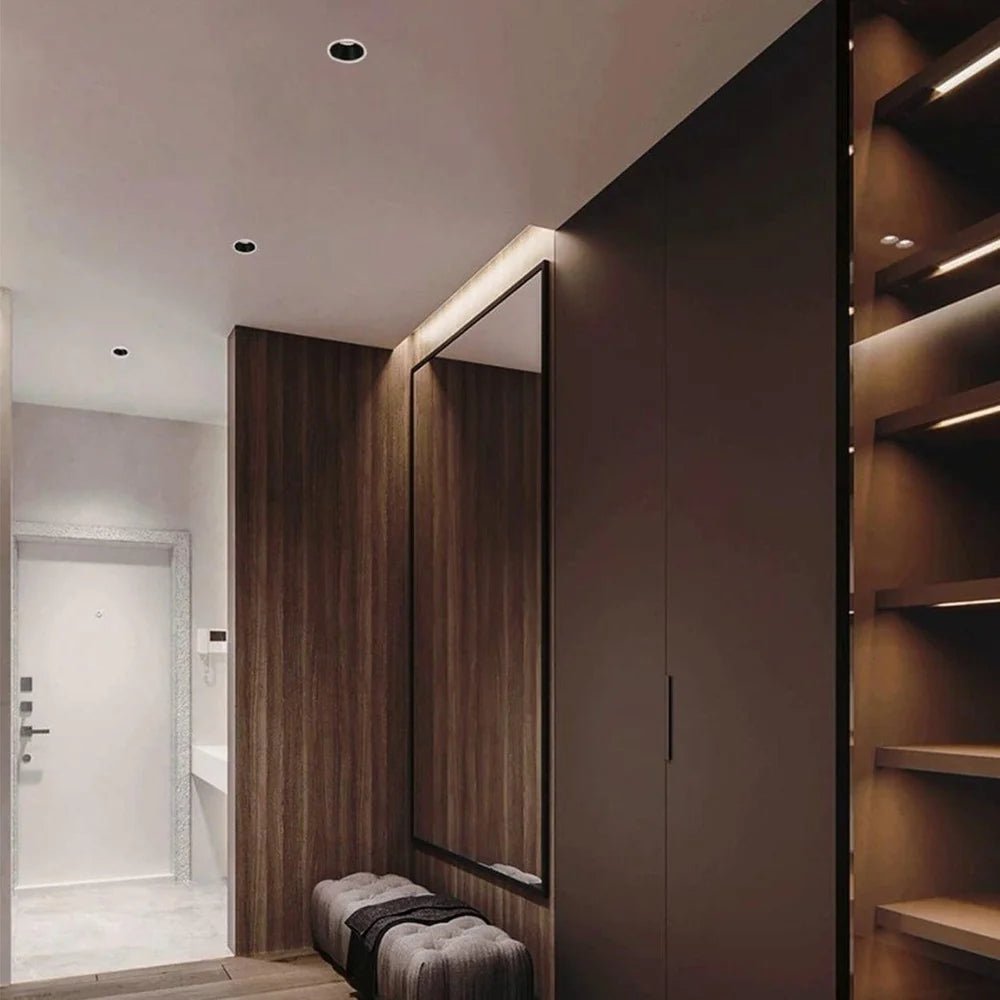 Modern interior with a mirror, bench, and wooden wall.