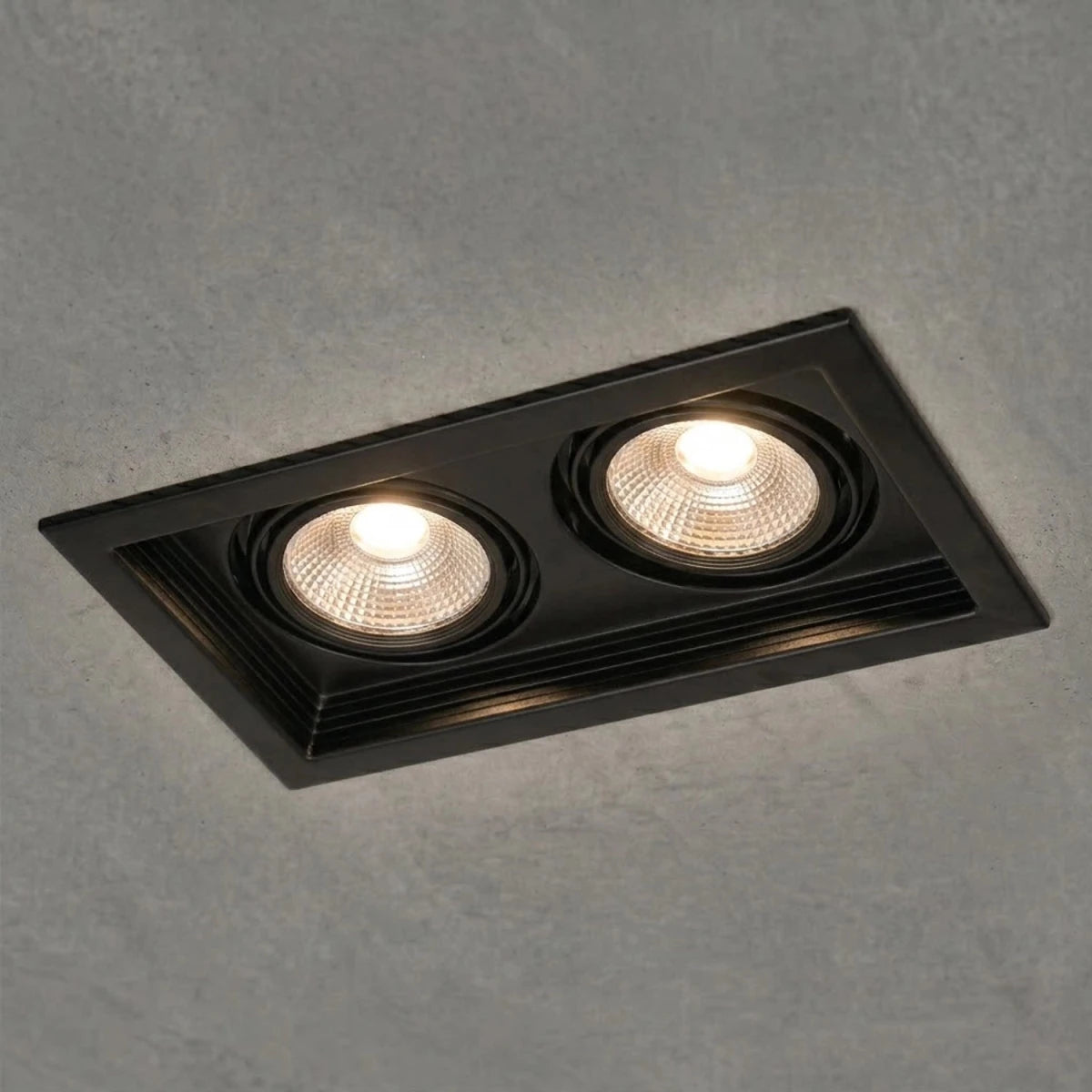 Black recessed ceiling light on a white background