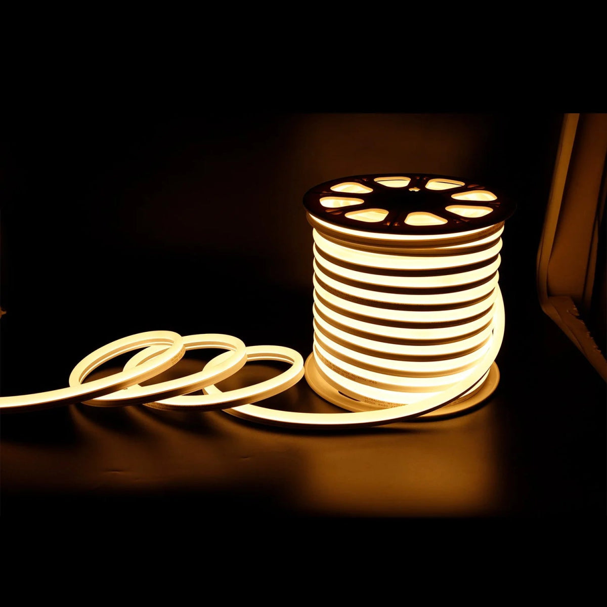 Spool of LED strip light on a dark background