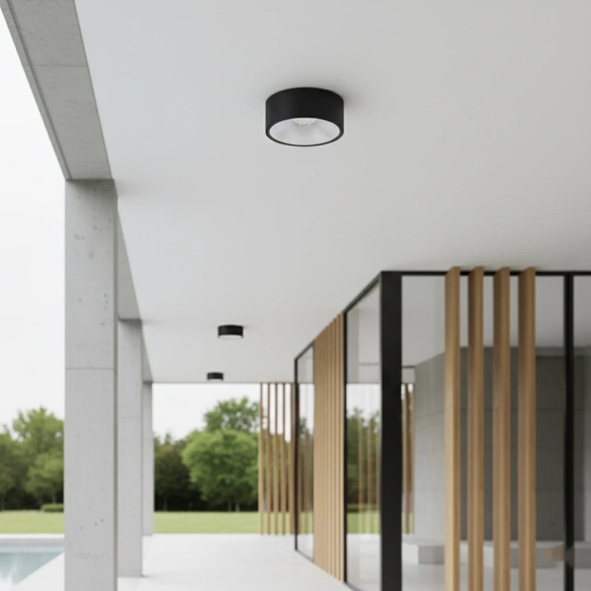 Modern outdoor setting with a black ceiling light fixture.