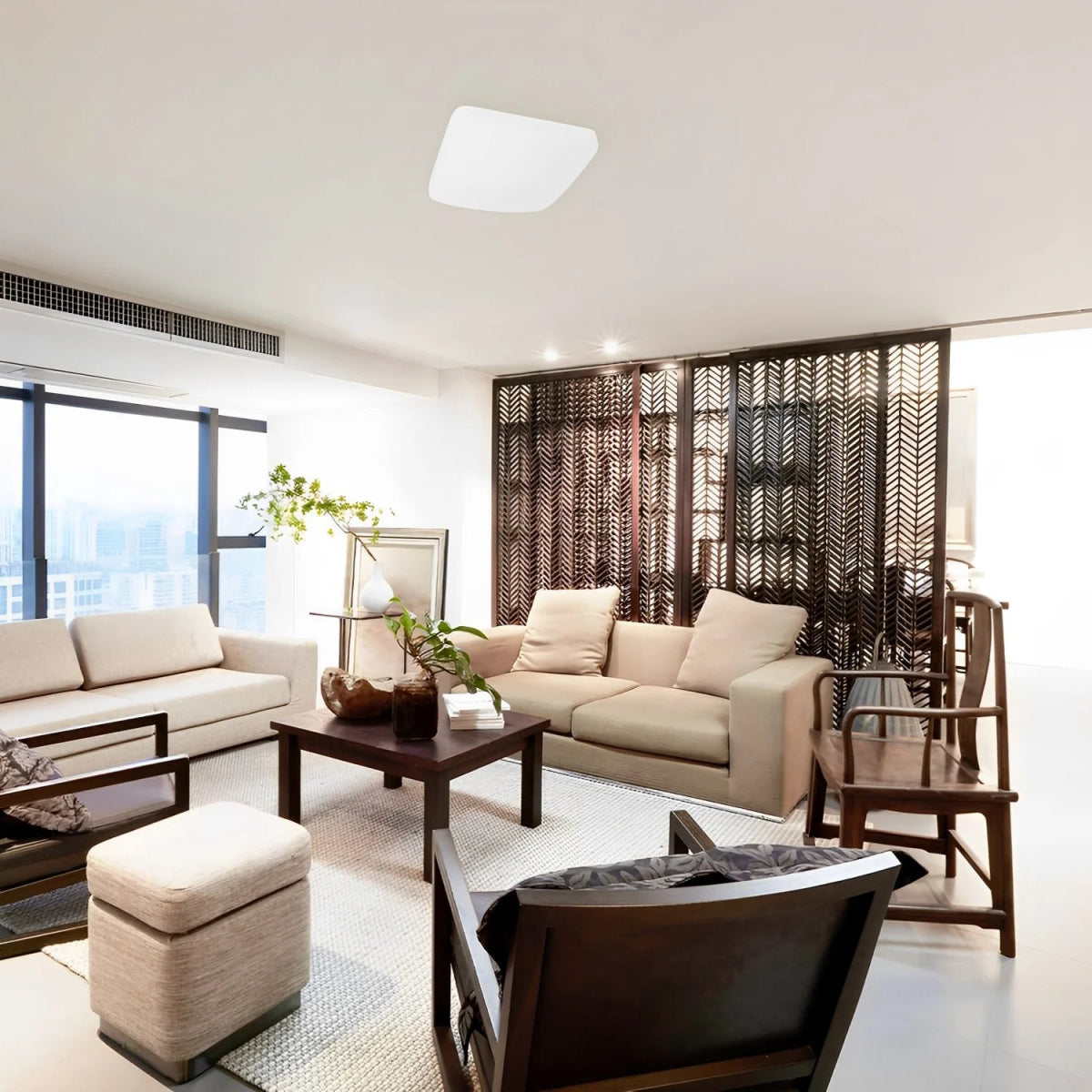 Modern living room with beige sofa, wooden coffee table, and decorative elements.
