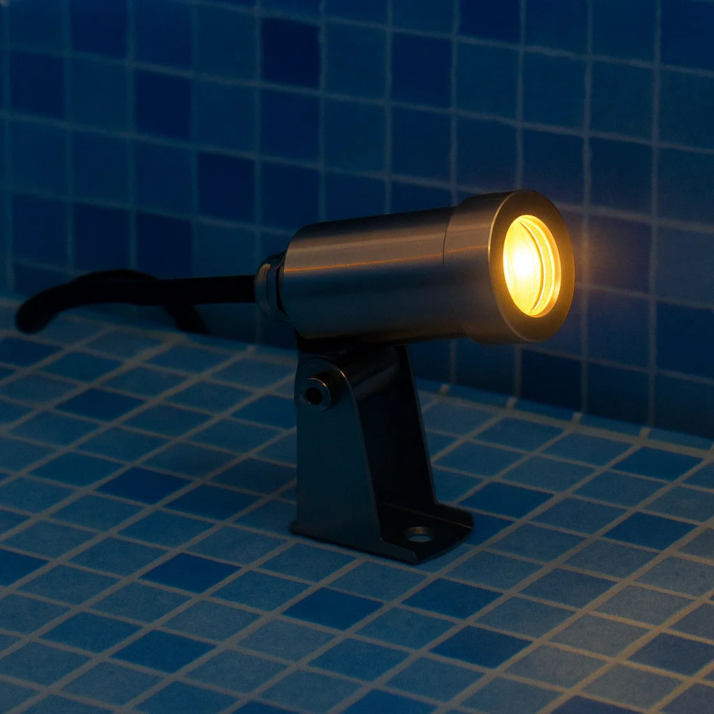 Light fixture on a tiled floor with a blue tile background