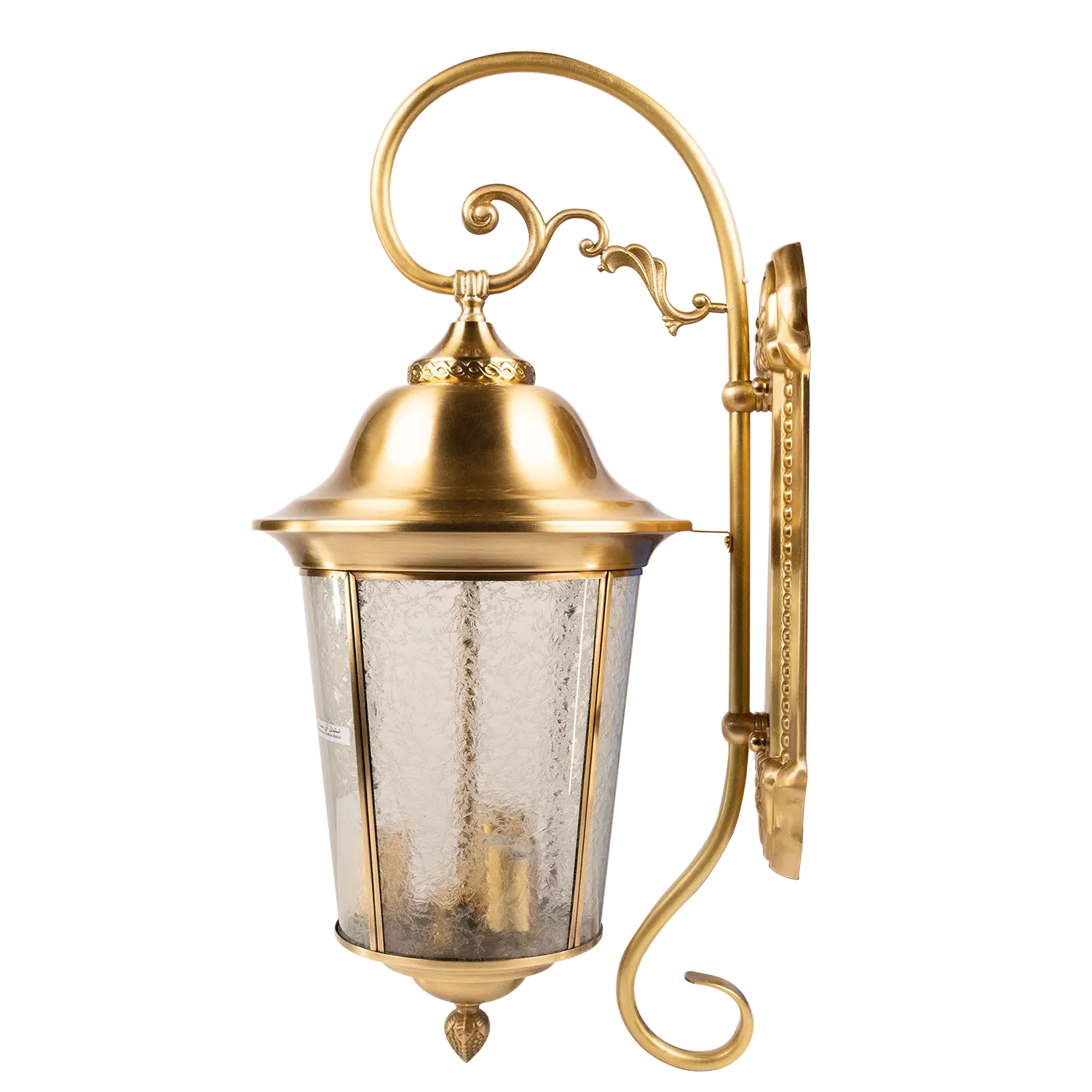 Gold outdoor wall light fixture with decorative design on a white background