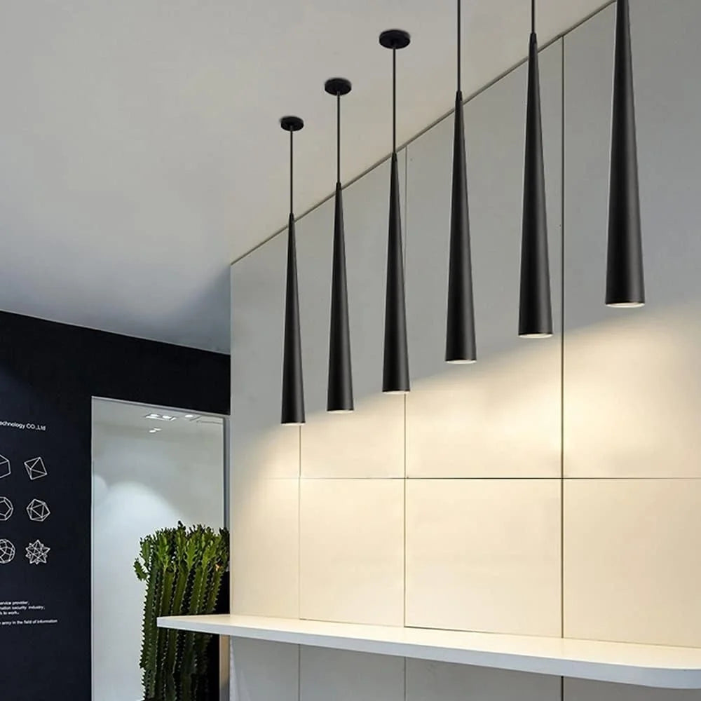 Modern pendant lights hanging in a minimalistic interior setting.