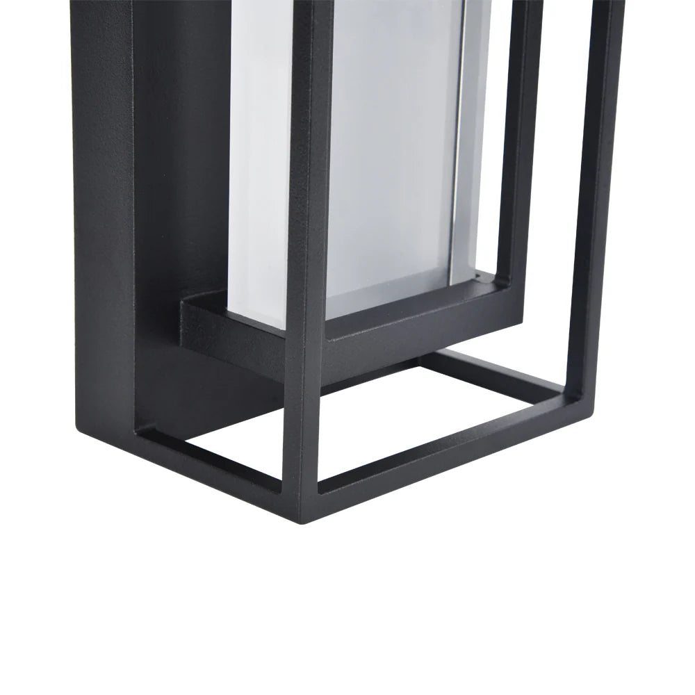 Black metal lantern with glass panel on a white background