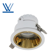 White and gold recessed ceiling light on a white background