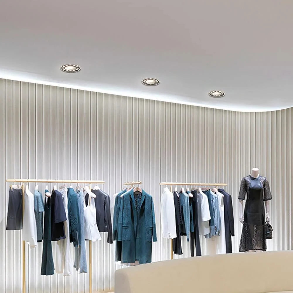 Ultralight Modern Recessed LED Ceiling Light FDS370 illuminating a stylish retail clothing store interior.