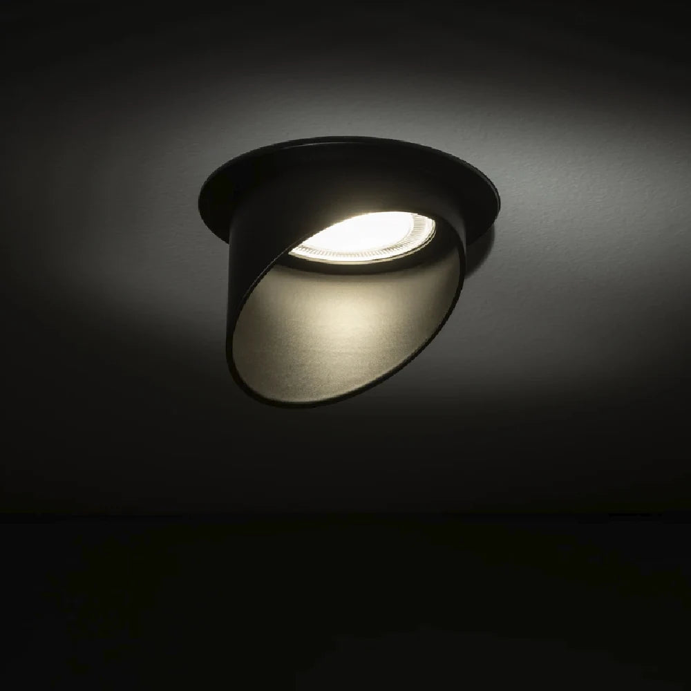 Black ceiling light fixture on a dark background