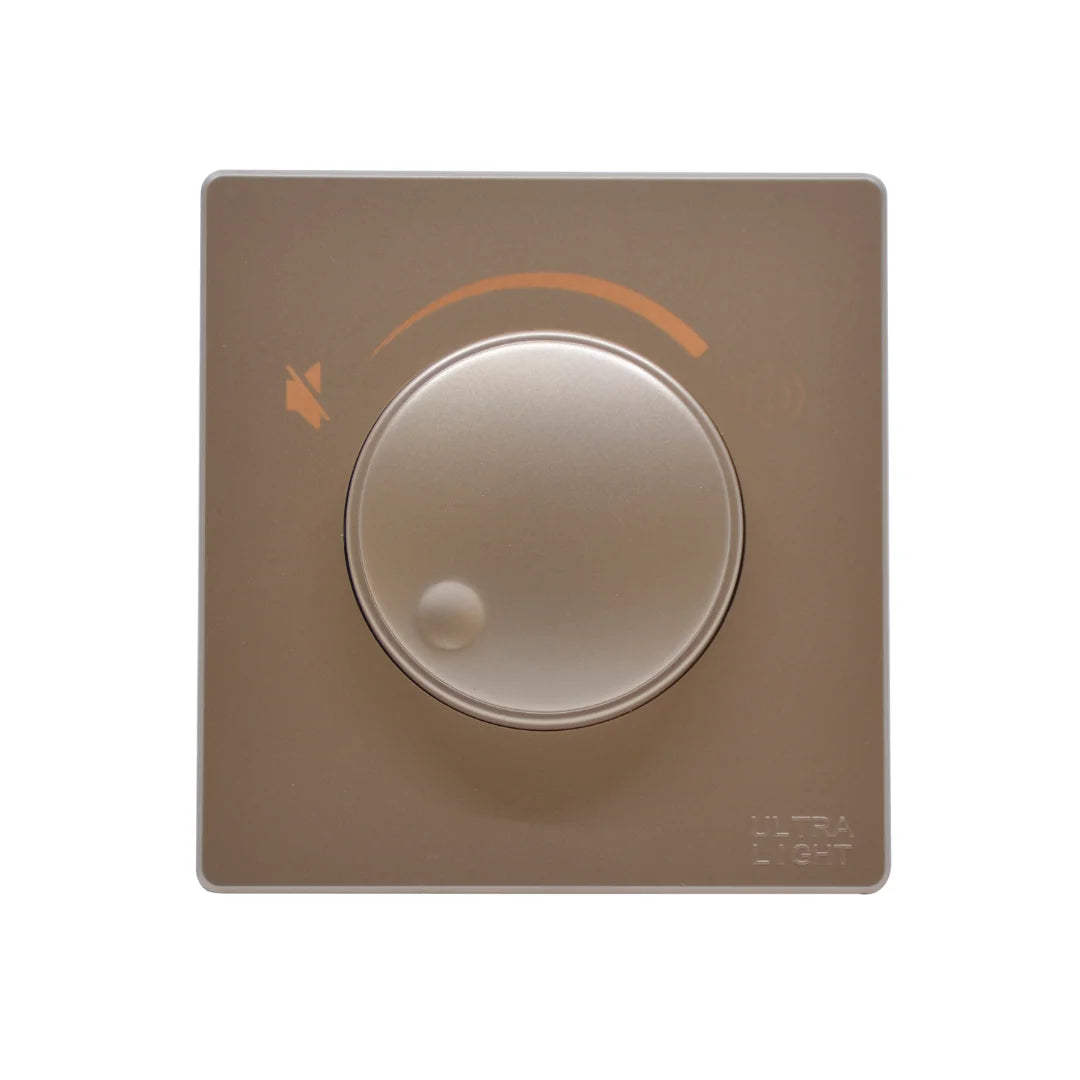 Beige light switch with circular design on a white background