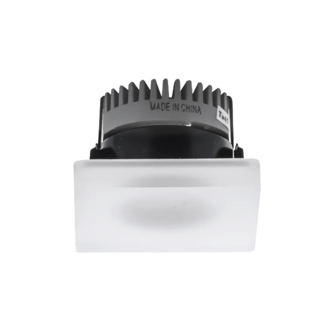 White light fixture with black textured top on a white background