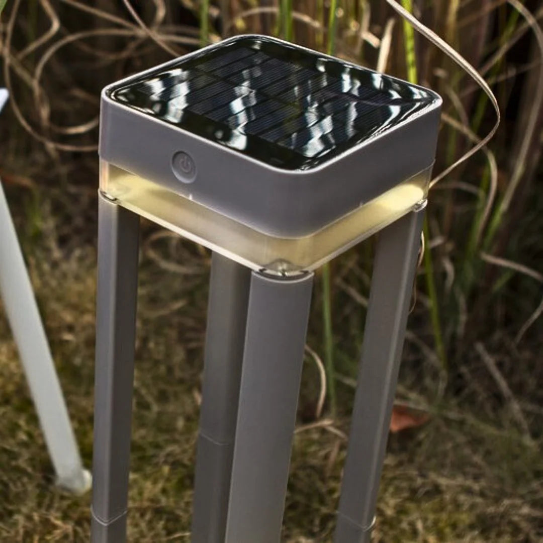 Solar-powered outdoor lamp with battery information on a gray background