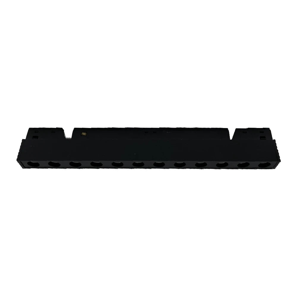 Black plastic component with multiple holes on a white background