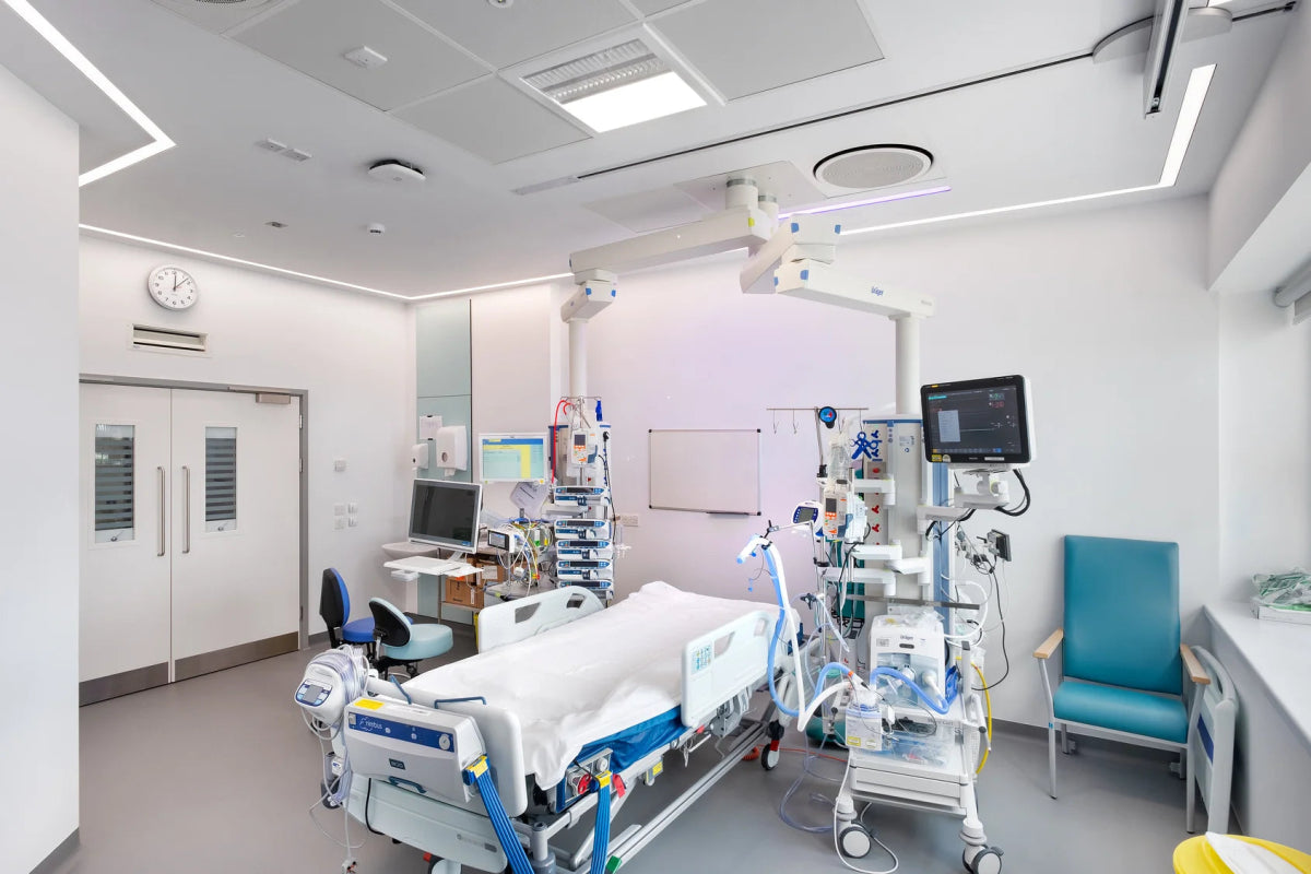 Modern hospital room with medical equipment and a bed