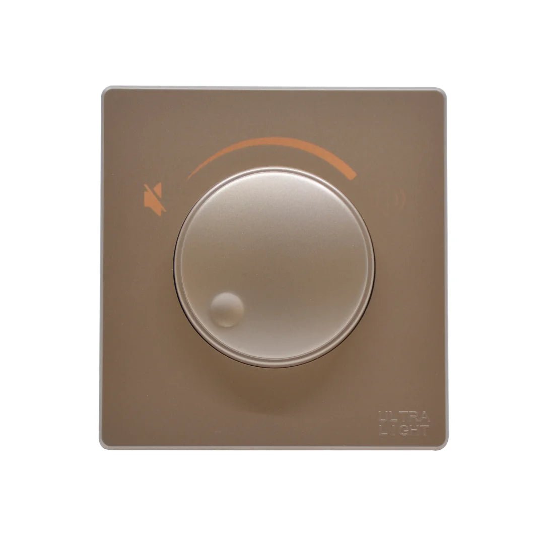 Beige light switch with circular design on a white background