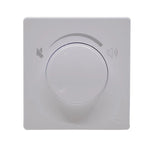 Gray wall-mounted control panel with a central dial on a white background