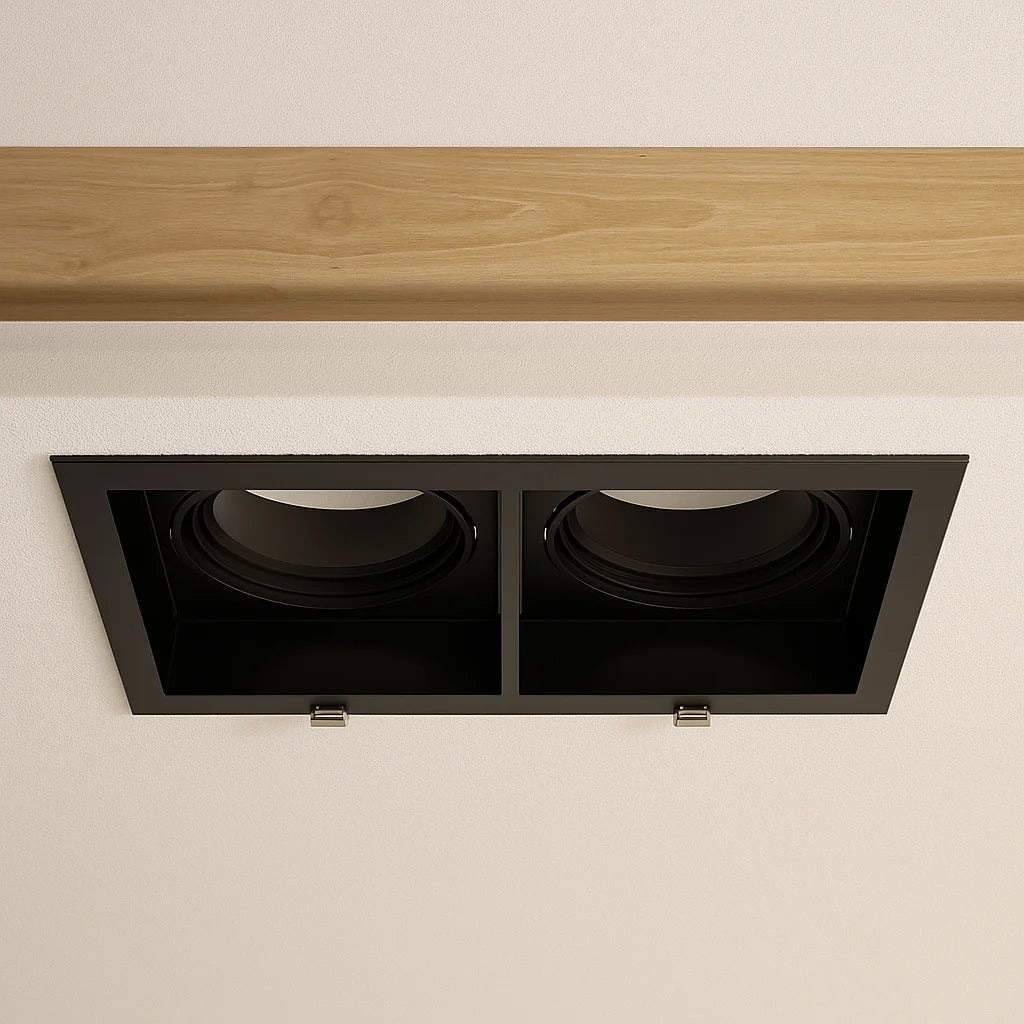 Wooden shelf with a black recessed light fixture on a beige wall.