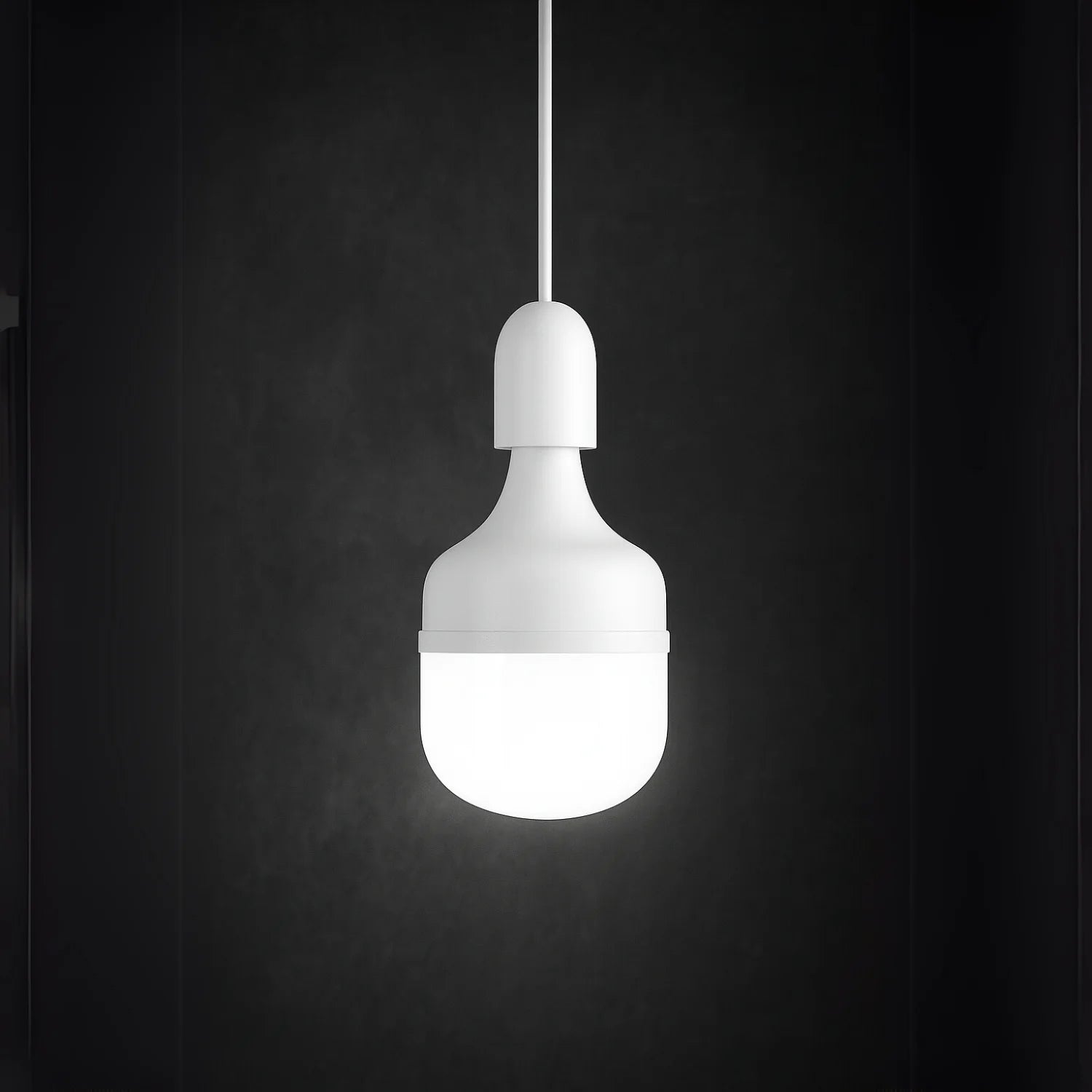 White pendant light bulb on a black background