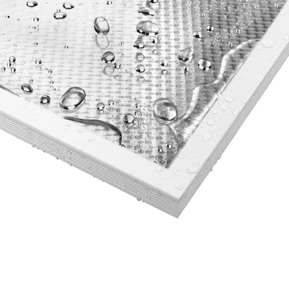 Close-up of a textured white surface with water droplets