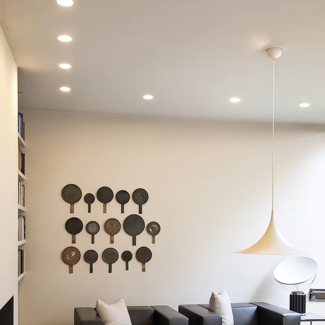 Wall with decorative paddle art in a modern living room setting