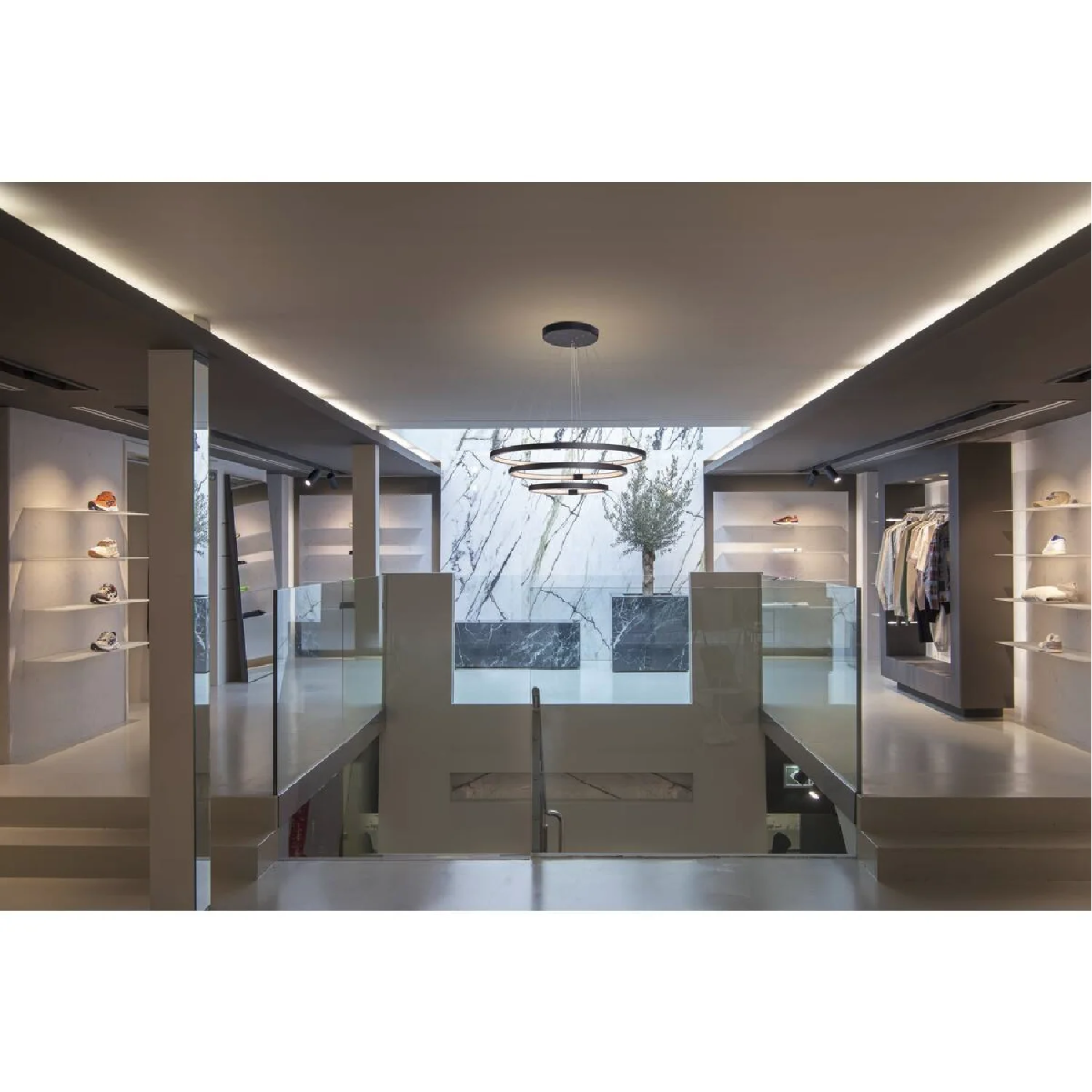 Modern interior design with glass walls and ceiling lights