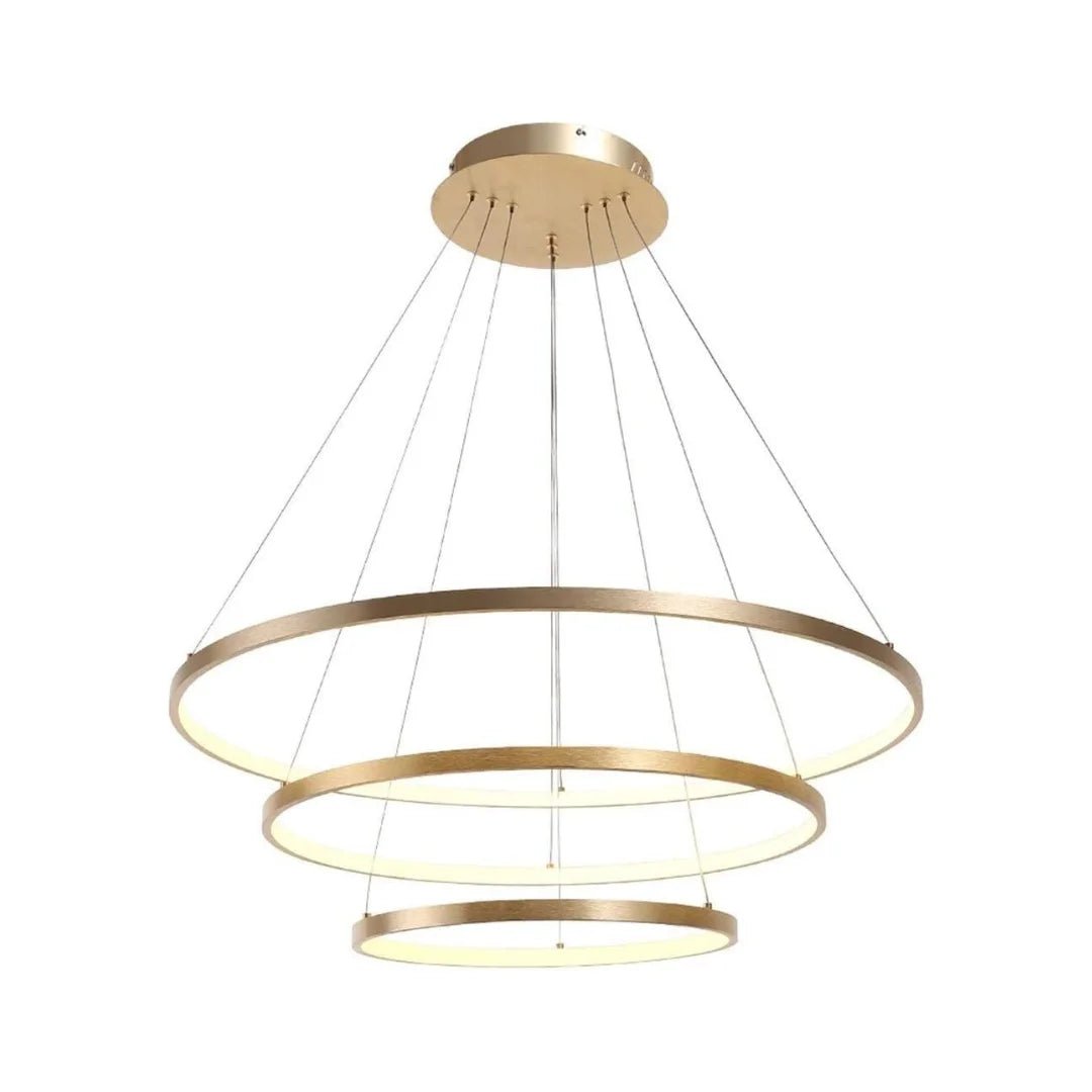 Gold pendant light with three circular designs on a white background