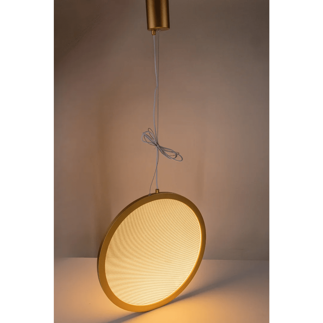 Pendant light with gold frame and textured shade against a neutral background