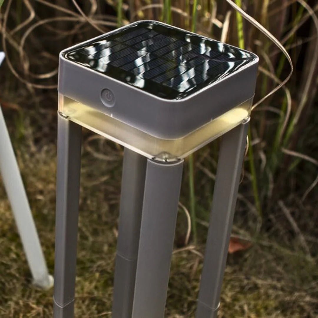 Solar-powered outdoor lamp with battery information on a gray background