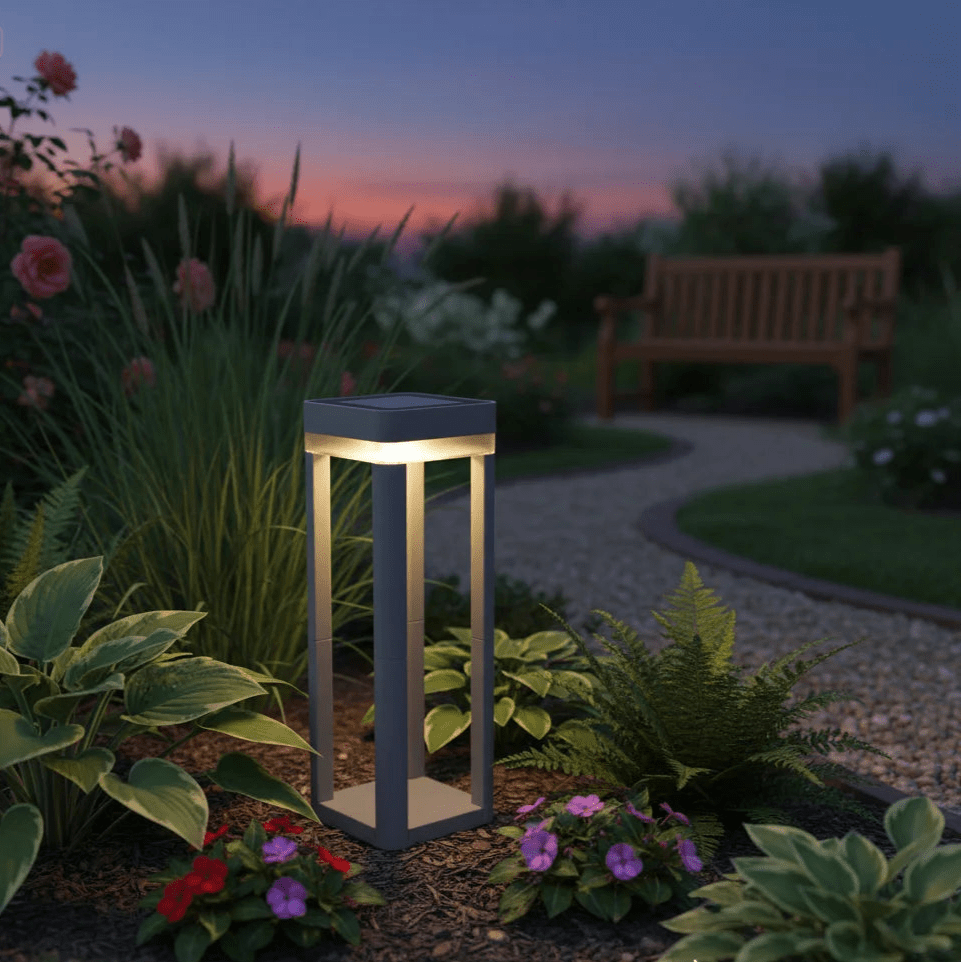 Garden light fixture in a garden setting with plants and a bench at dusk.