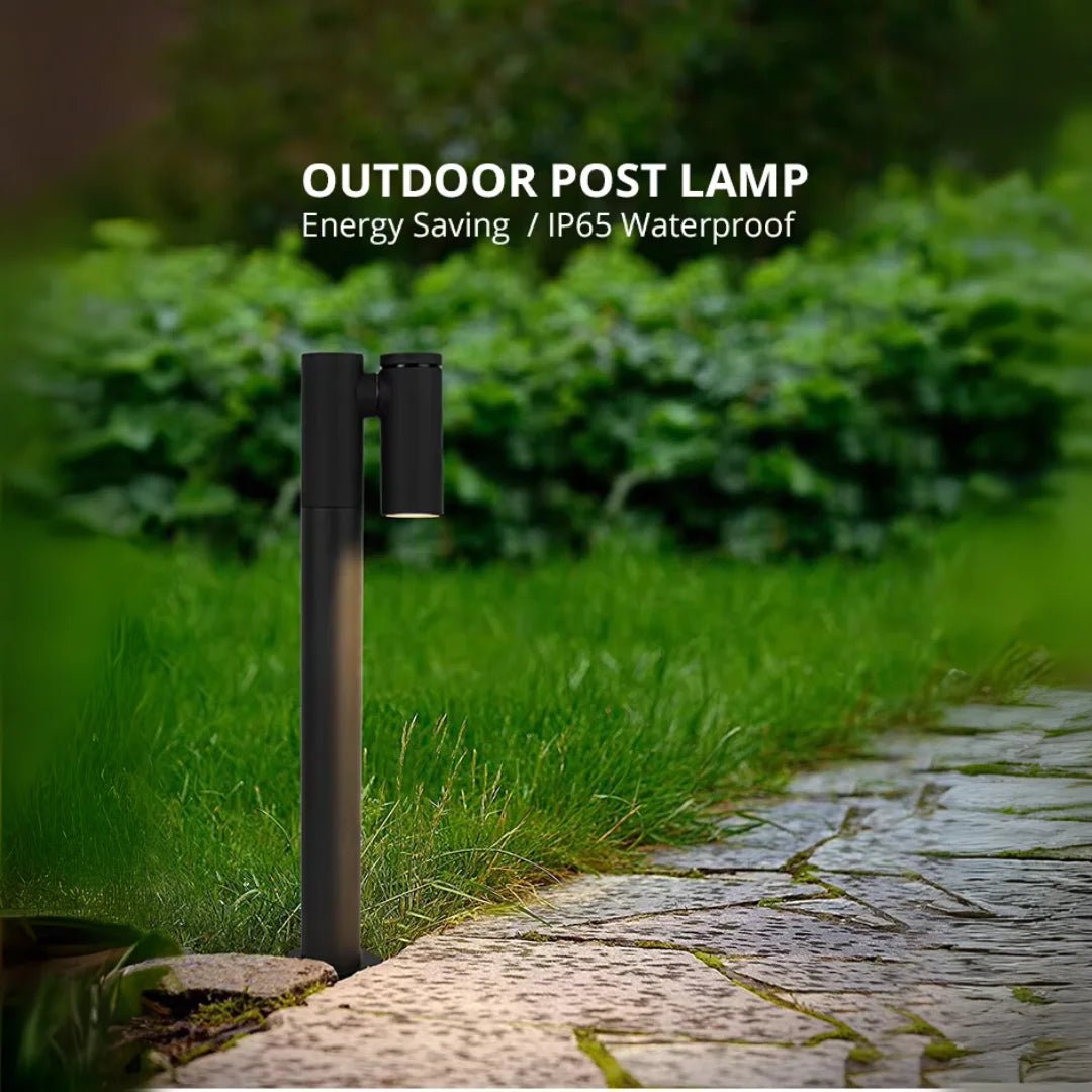 Outdoor post lamp on a grassy area with a pathway