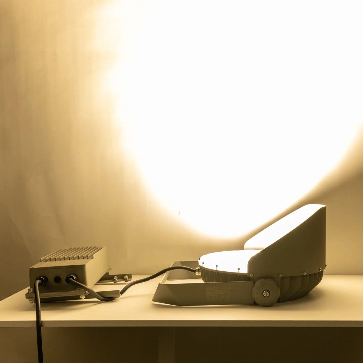 Small robot or device on a surface with a warm light in the background