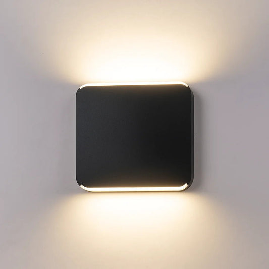 Square wall light fixture on a gray wall