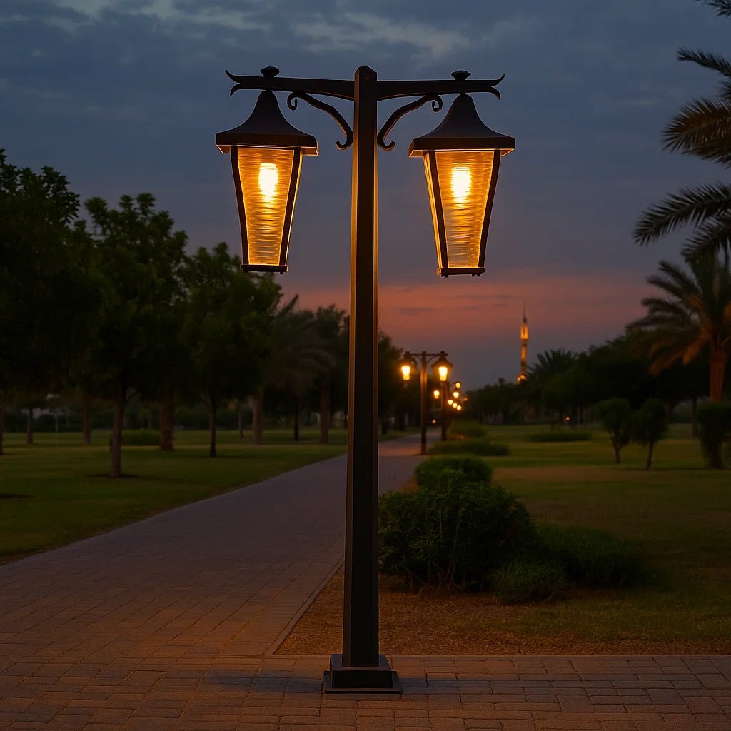 Street lamp illuminating a pathway in a park at dusk