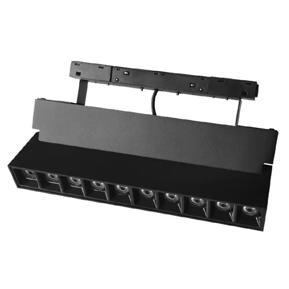 Black stage light fixture with multiple bulbs on a white background