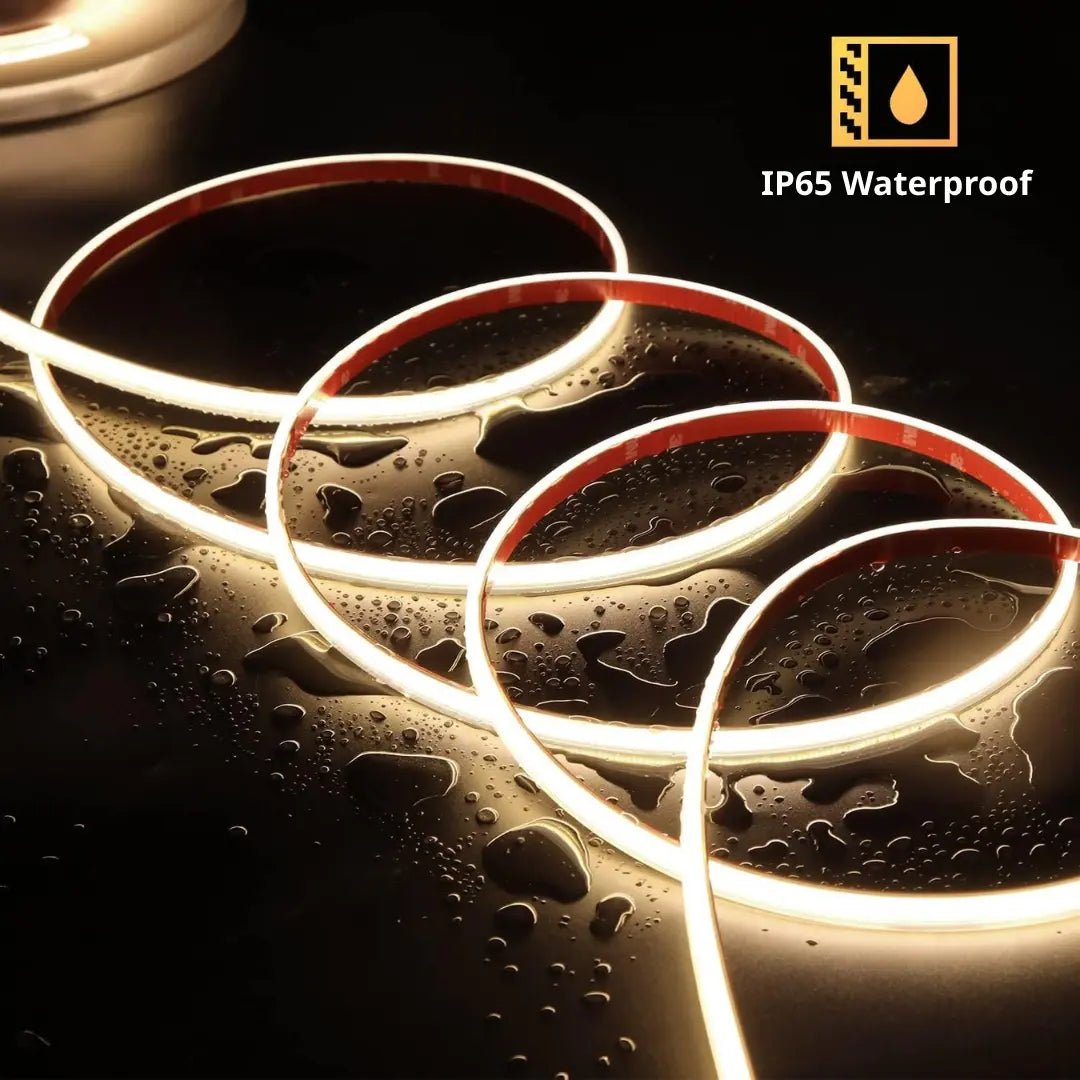 LED strip lights with water droplets on a dark surface, featuring IP65 waterproof rating.