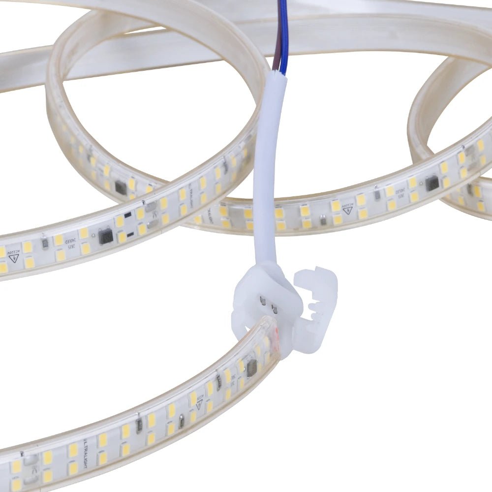 Close-up of LED strip light with connectors on a white background
