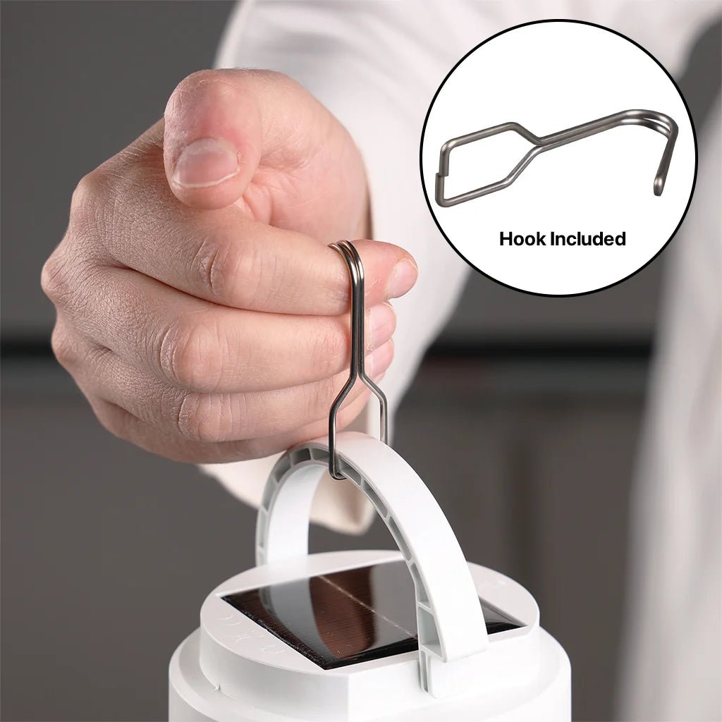 Hand using a white device with a hook included, on a gray background