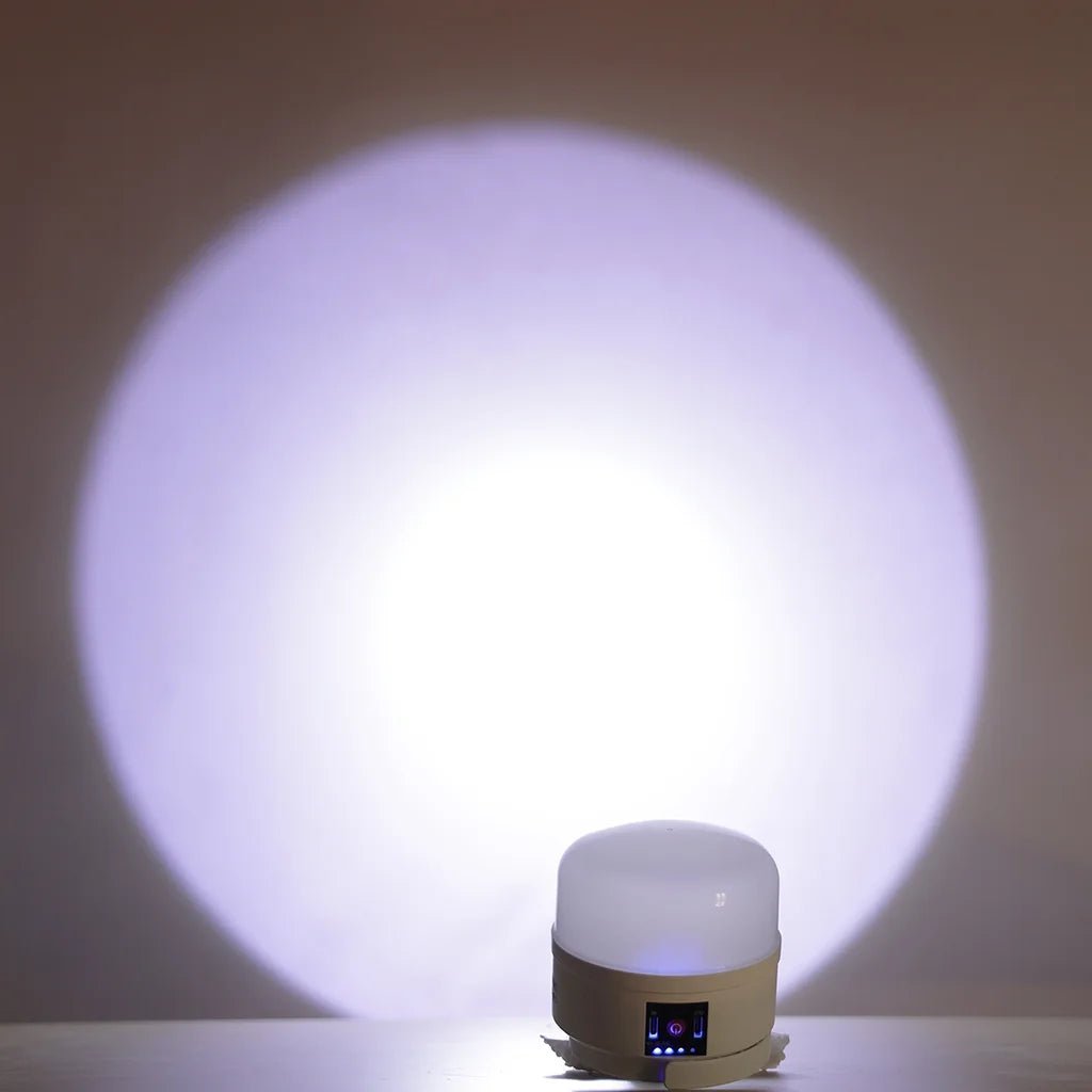 Small cylindrical light emitting a bright white glow on a dark background