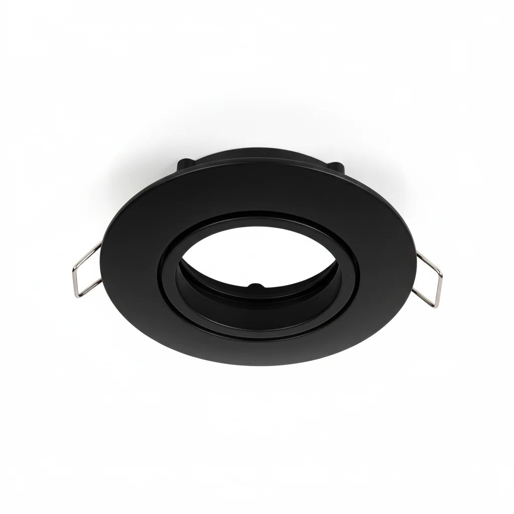 Black circular metal component on a white background