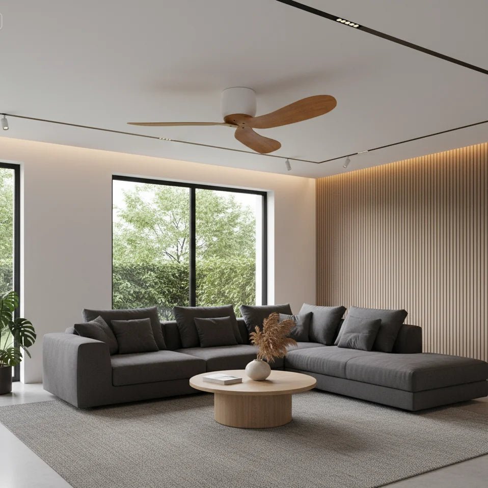 Modern living room with a gray sectional sofa, wooden coffee table, and ceiling fan.