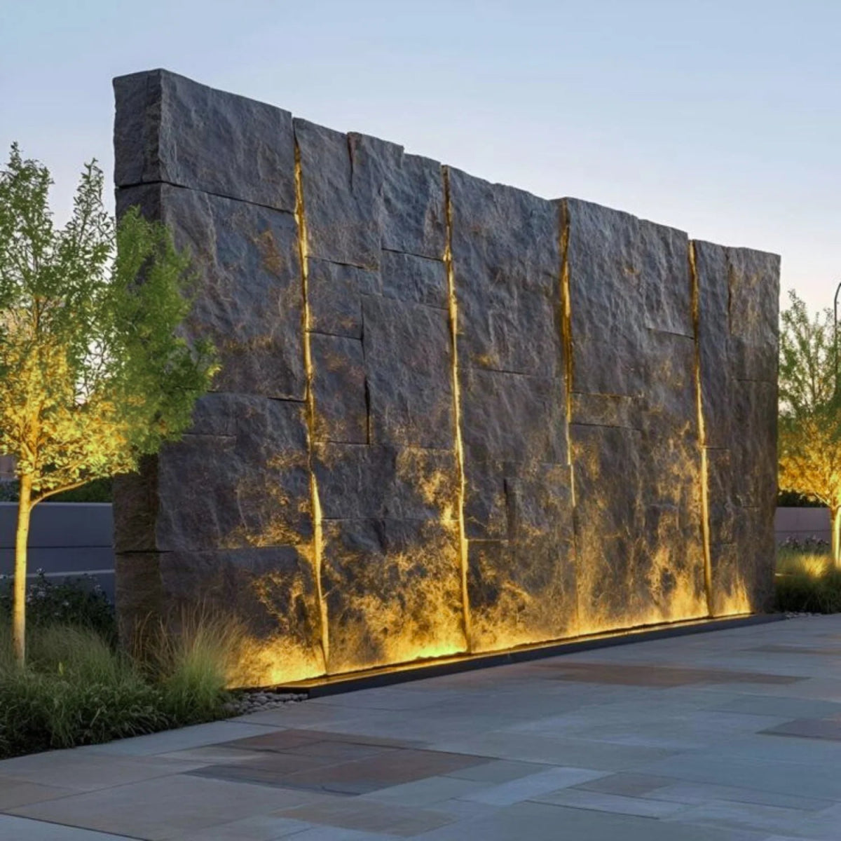 Large stone wall with illuminated panels in an outdoor setting