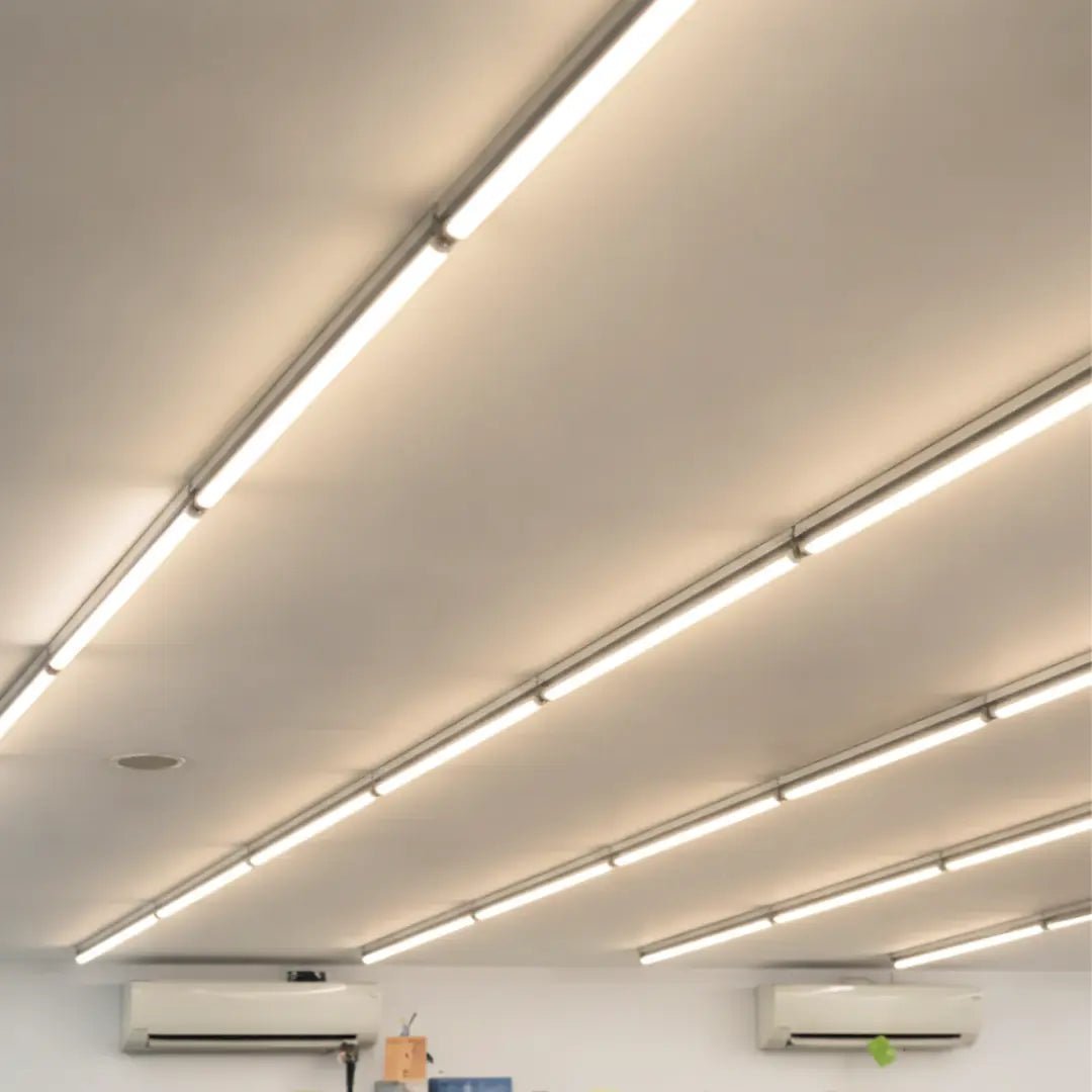 Ceiling with linear LED lights and air conditioning units.