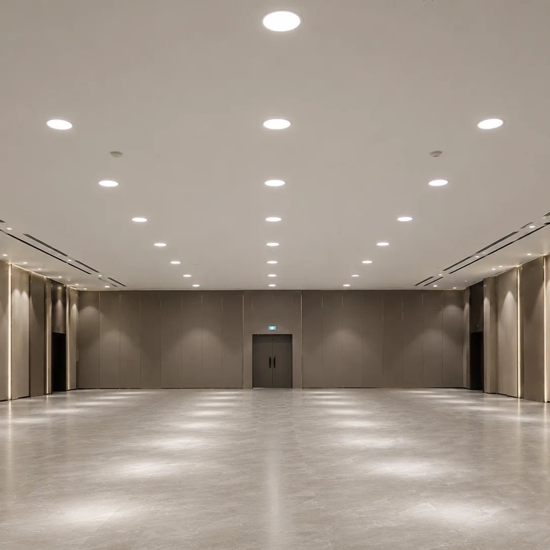 Large empty room with beige walls and a polished concrete floor.