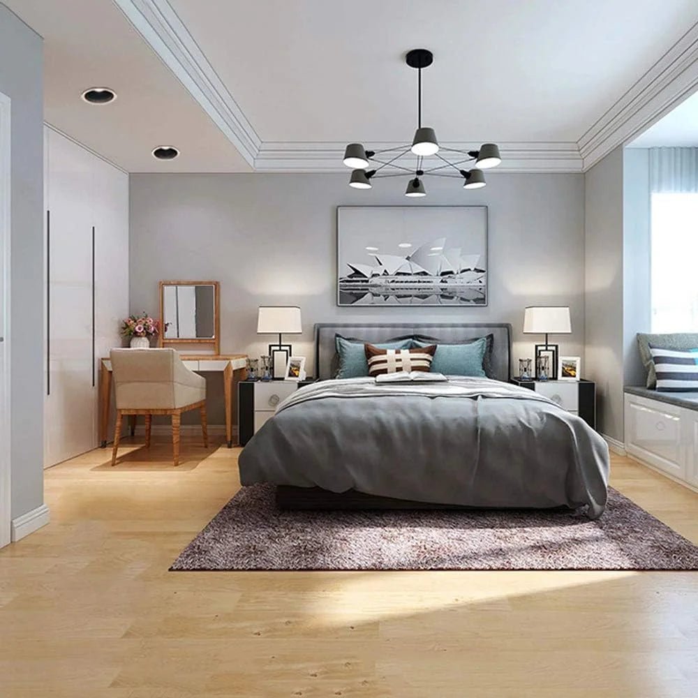 Modern bedroom with a bed, lamps, and decor