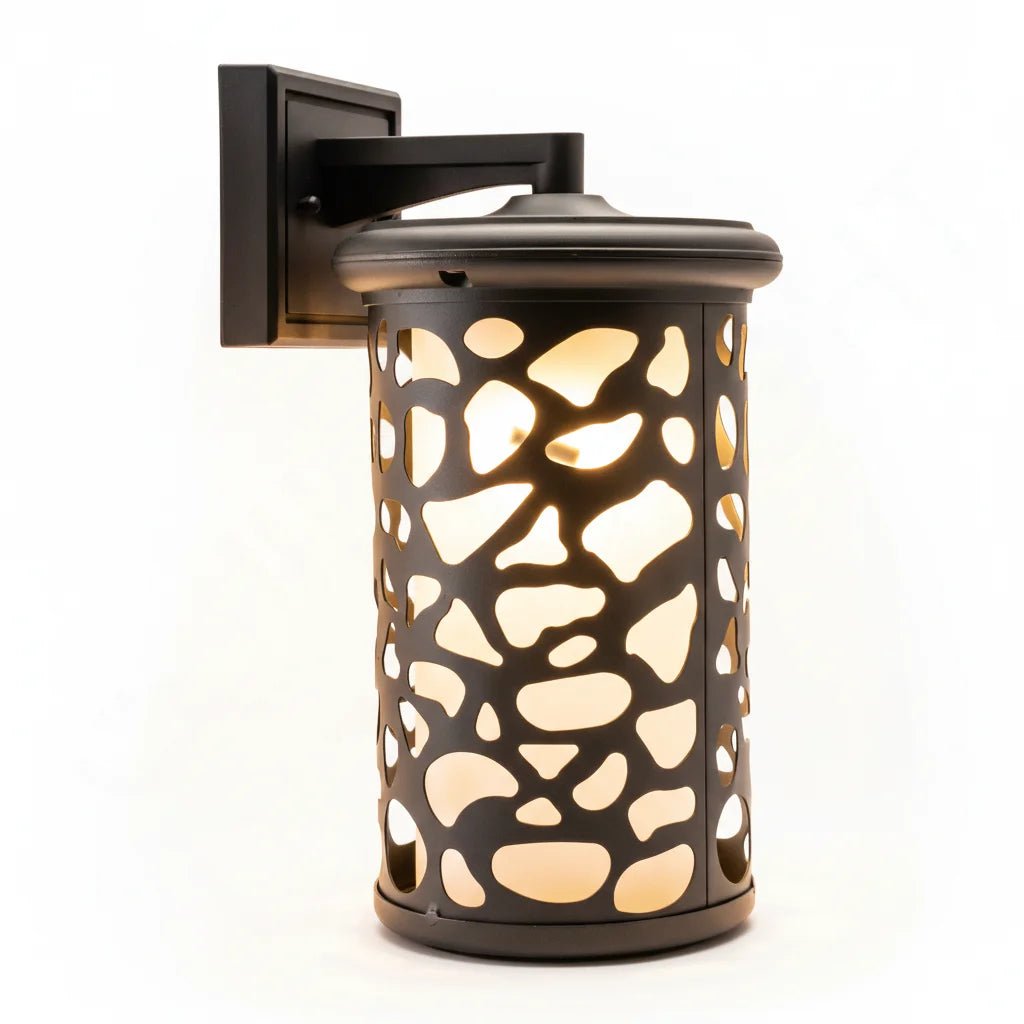 Decorative wall-mounted lantern with a patterned design on a white background
