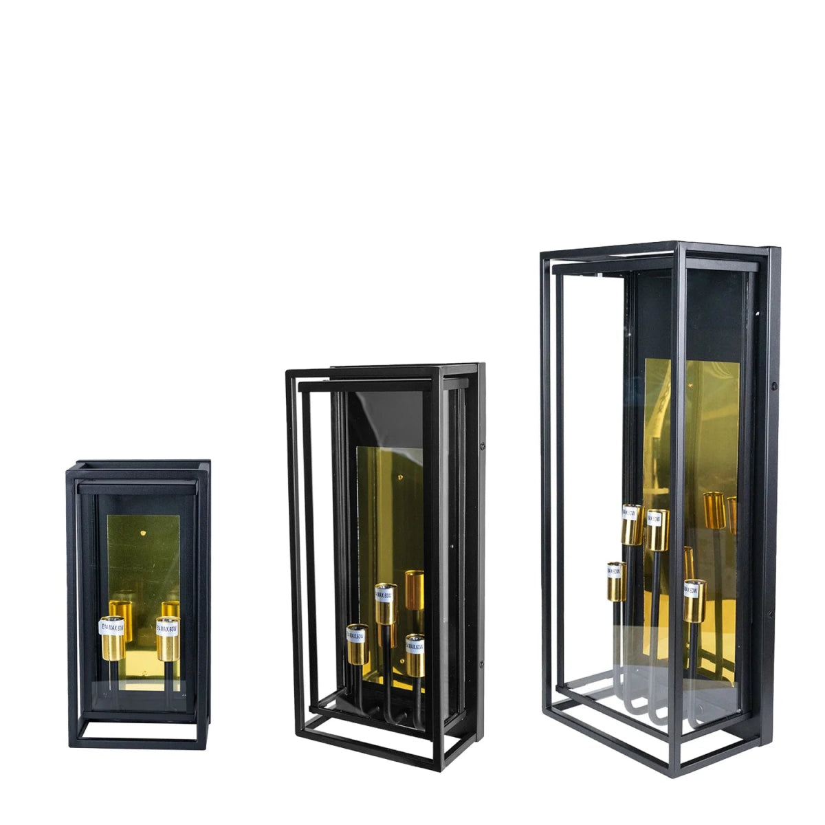 Three black glass display cases with gold bottles on a white background