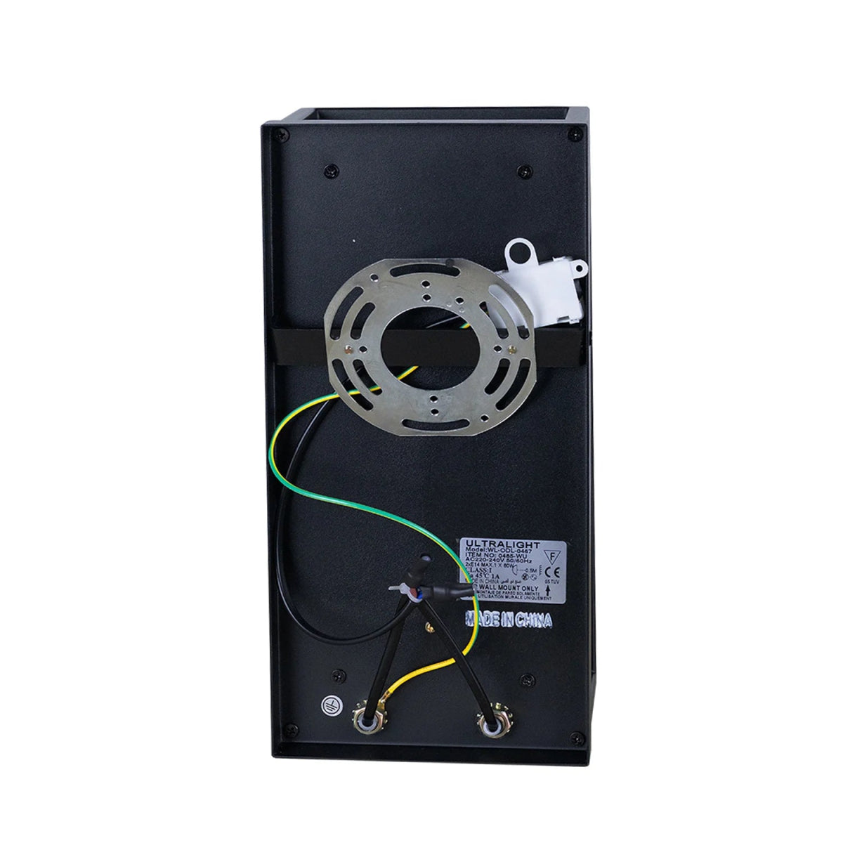 Back view of a black electronic device with wiring and components on a white background