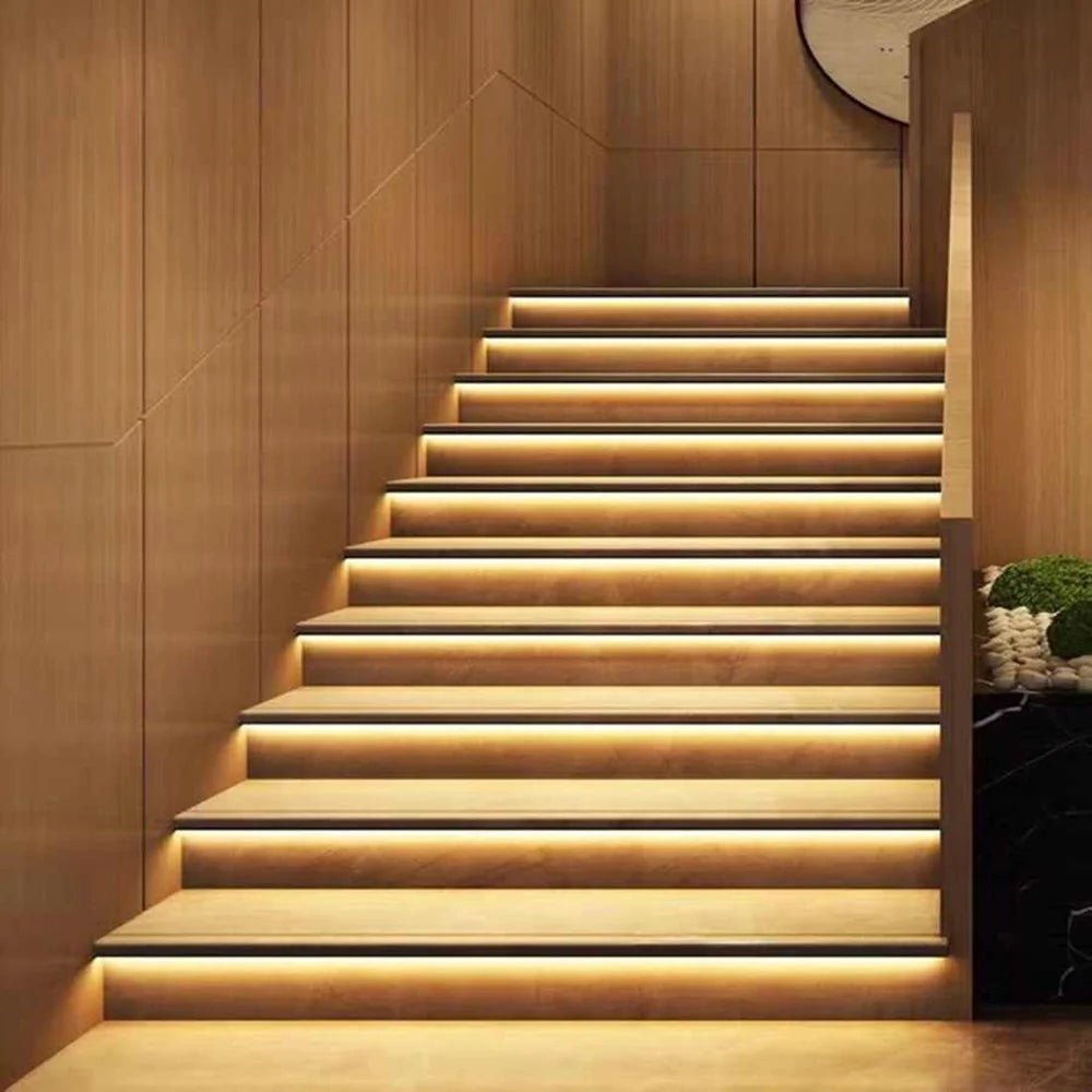 Staircase with embedded lighting in a wooden interior setting